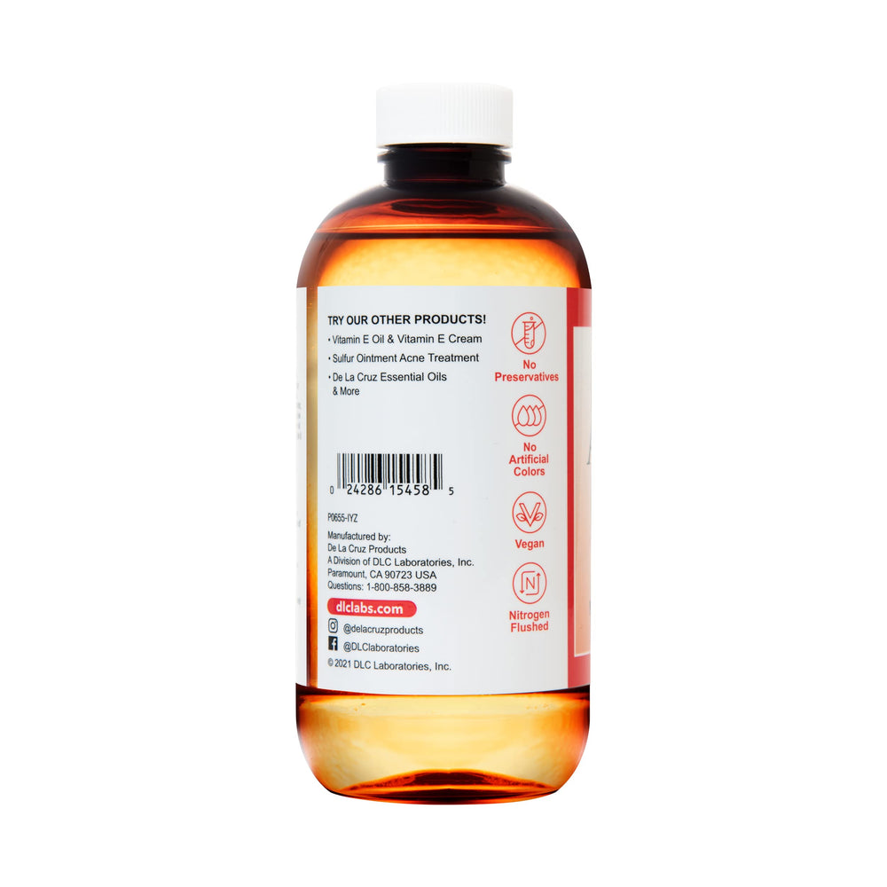 De La Cruz Sweet Almond Oil close-up shows light, fast-absorbing texture.