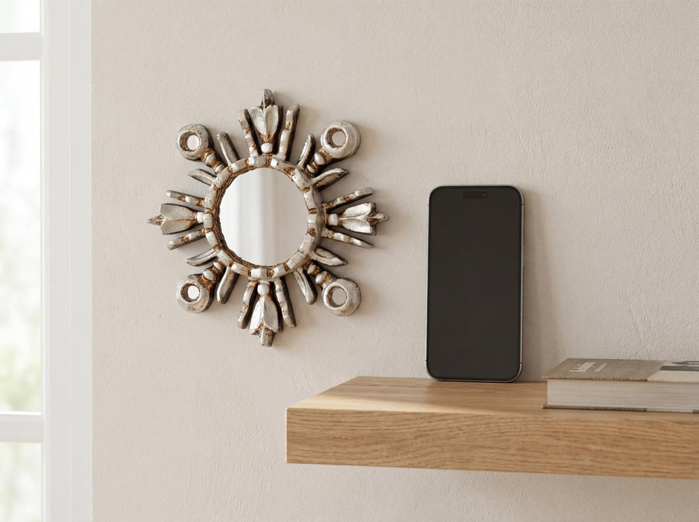 DecorContreras hand-carved wood sunburst with silver leaf finish.