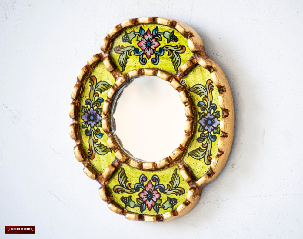 DecorContreras oval mirror showcases textured floral brushstrokes and warm color.