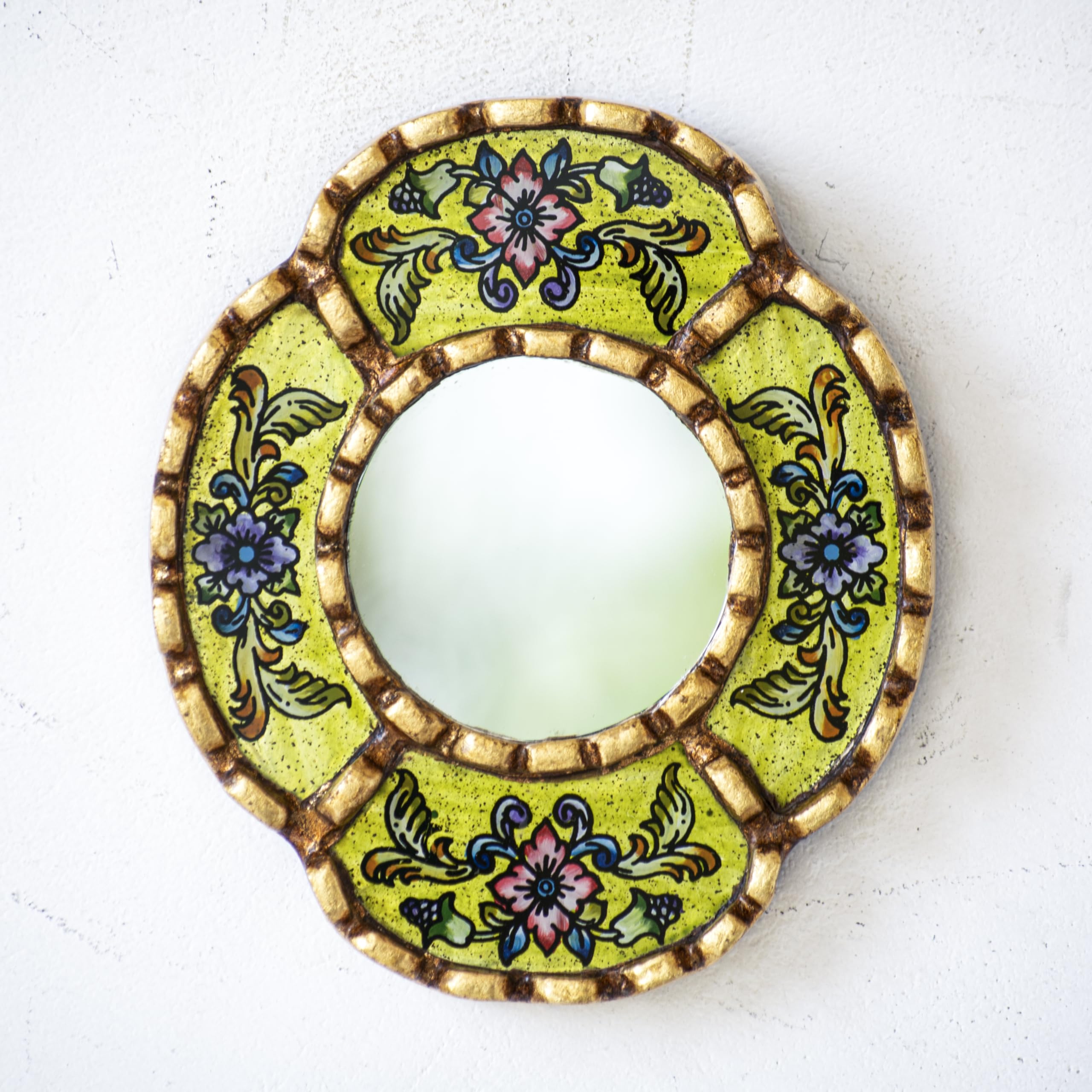 DecorContreras reverse-painted glass mirror reveals a lemon background with depth.