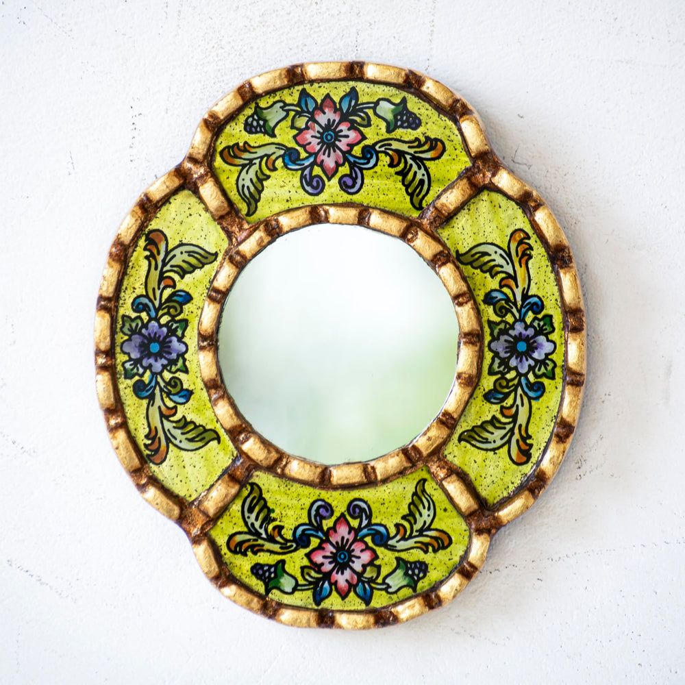DecorContreras reverse-painted glass mirror reveals a lemon background with depth.