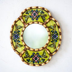 DecorContreras reverse-painted glass mirror reveals a lemon background with depth.