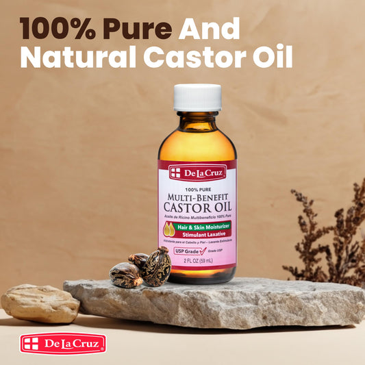 De La Cruz Castor Oil label close-up on clear glass bottle.