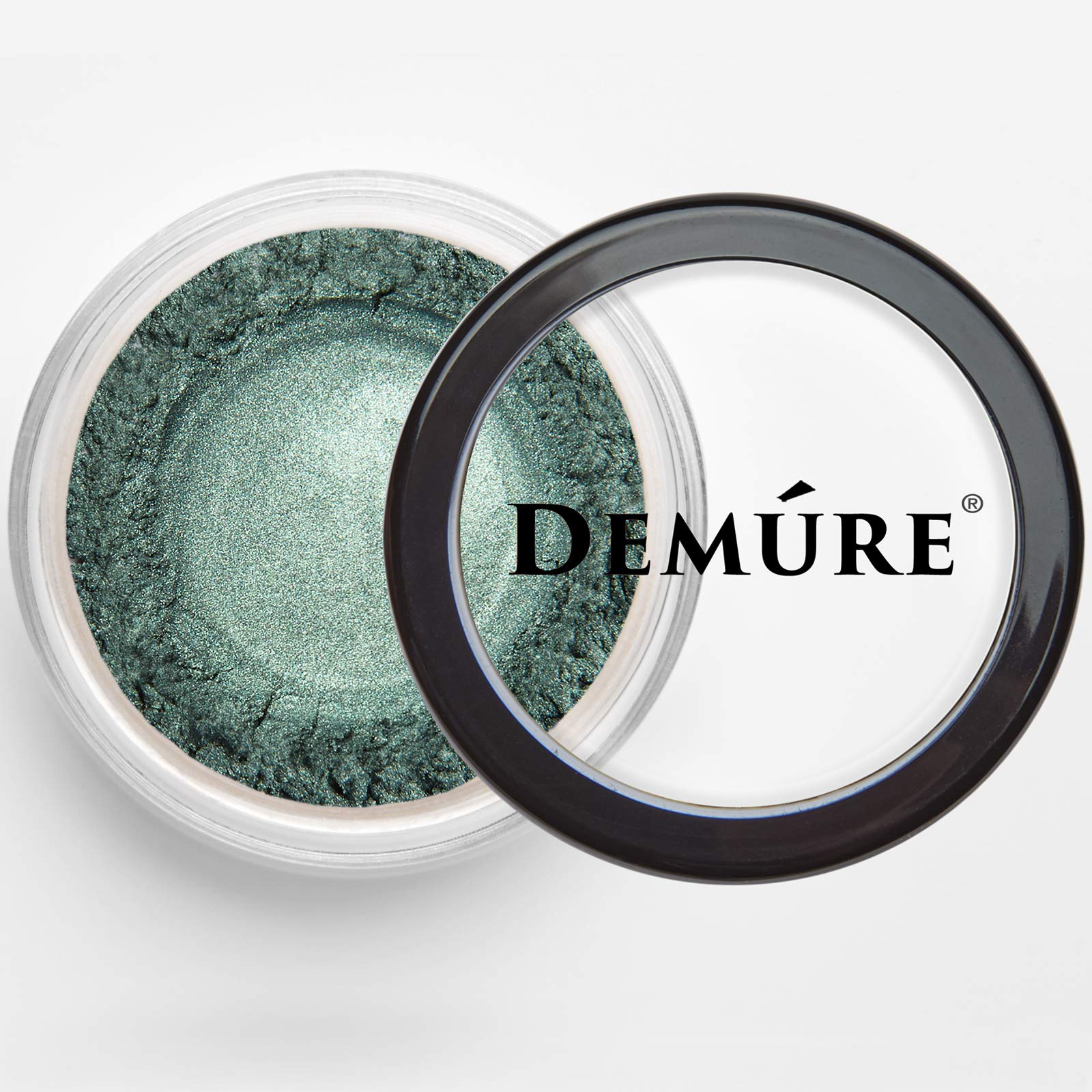 DEMÚRE Glitter eye shadow close-up reveals fine emerald sparkle on skin