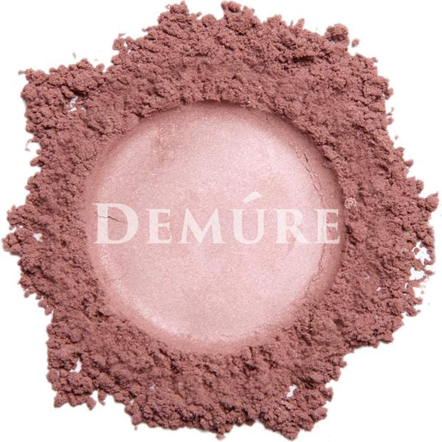Demure Mineral Blush mauve powder closeup showing fine pigment and smooth texture.
