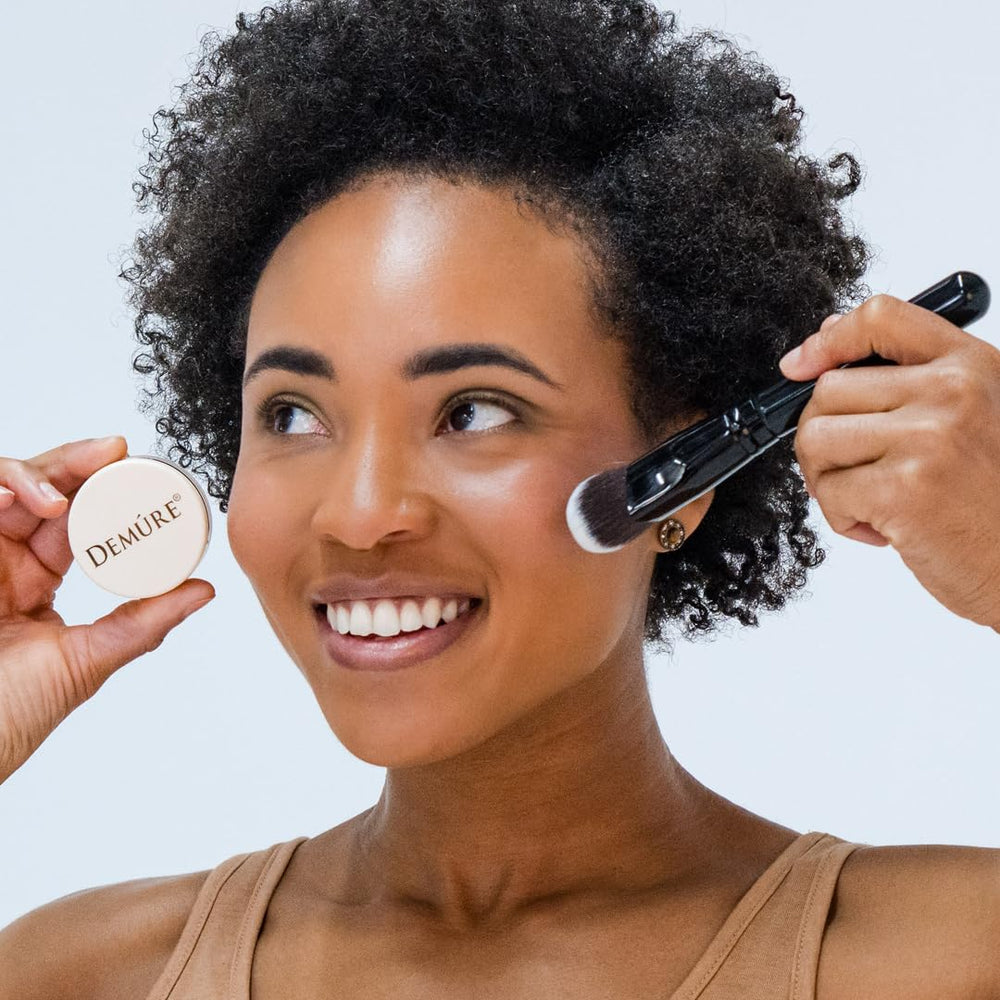 DEMÚRE Demure Mineral Blush Pink Fusion water-resistant finish on cheek.