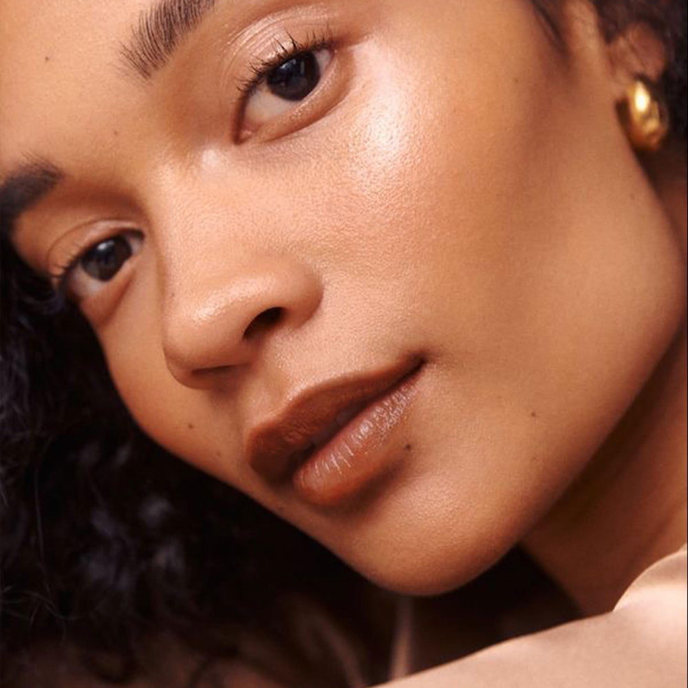 Depuplum lip finish on lips shows glossy hydrated look