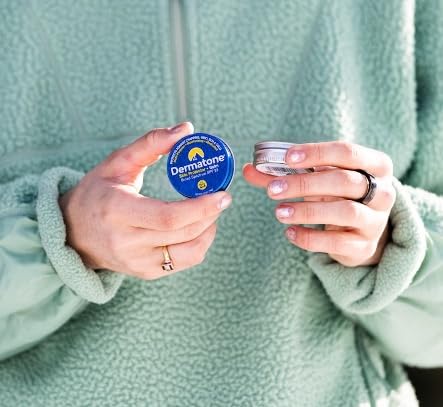 Dermatone balm in pocket-ready tin for on-the-go SPF protection during hikes.