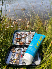 Dermatone Sport Sunscreen Lotion in a backpack for outdoor adventures