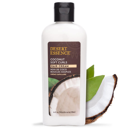 Desert Essence Coconut Soft Curls Hair Cream bottle pour highlighting silicone-free formula for smooth curls.