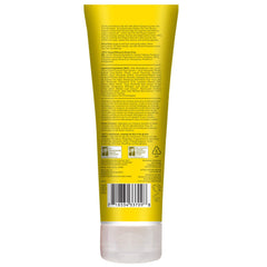 Close-up of shampoo ingredients showing lemon and tea tree oils for refreshing cleansing.