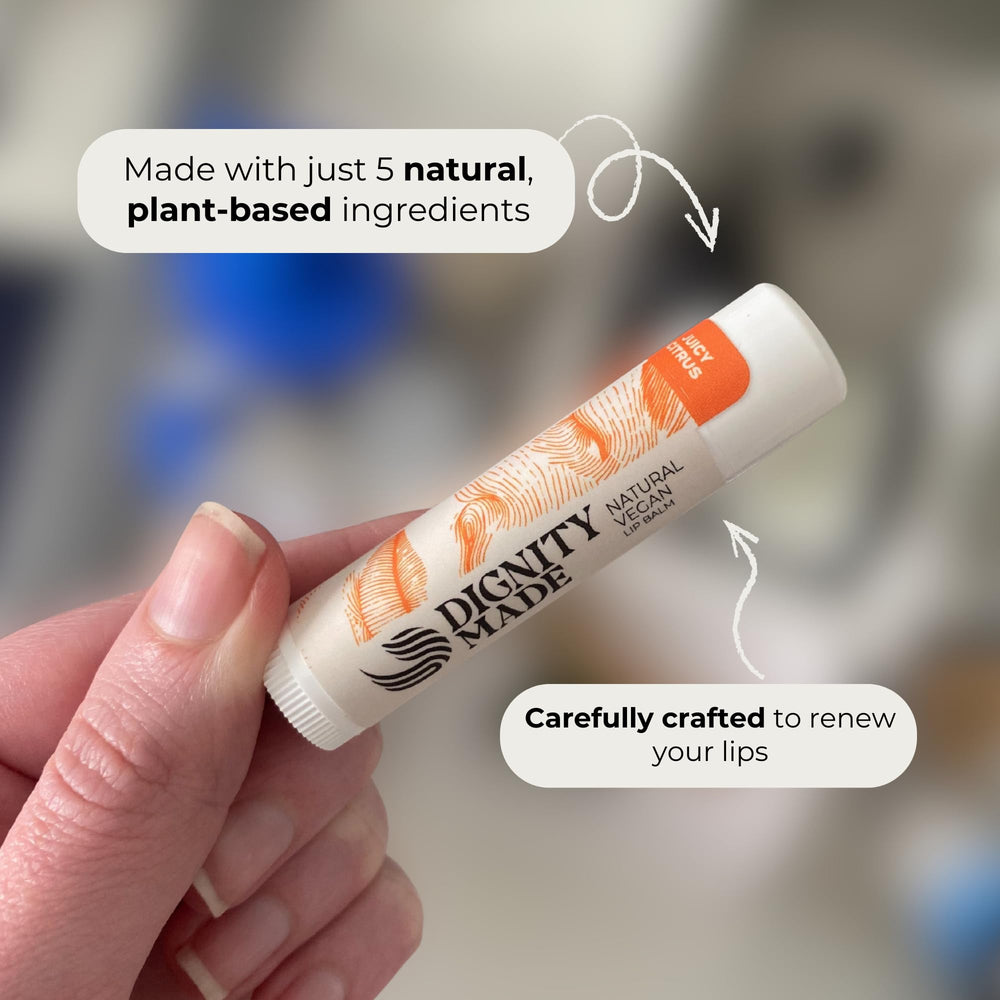 Dignity Coconuts juicy citrus lip balm close-up offering refreshing moisture.