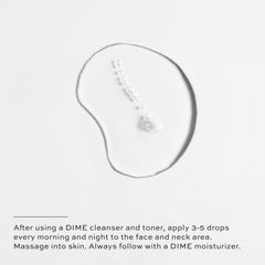 DIME Beauty TBT Serum glass bottle on skin showing smooth texture and absorption