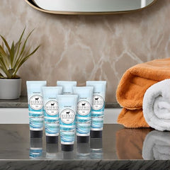 Dionis Goat Milk Hand Cream Ocean Mist tube resting on a vanity