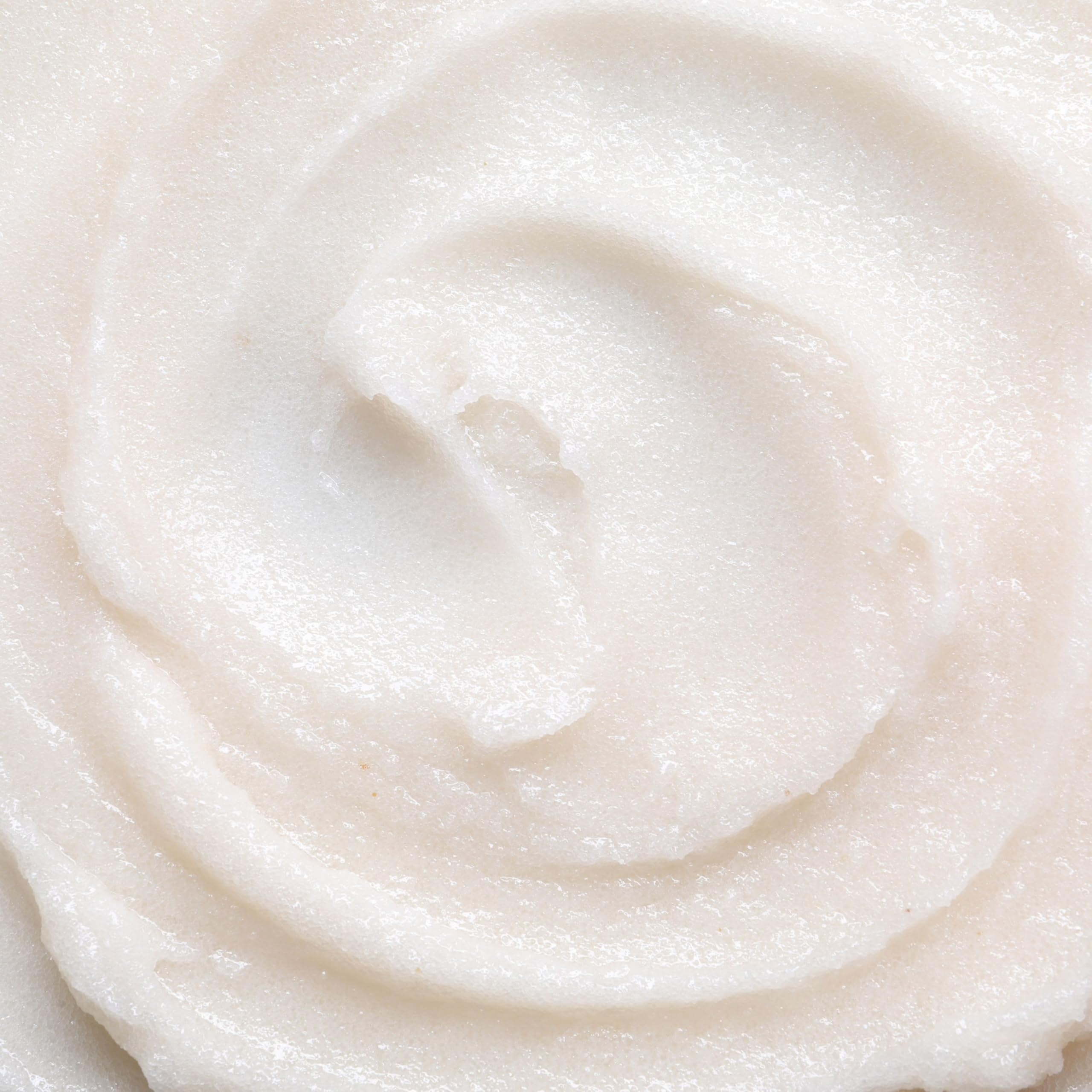 Ingredients on wooden board: goat milk, chamomile, sugar for skin care