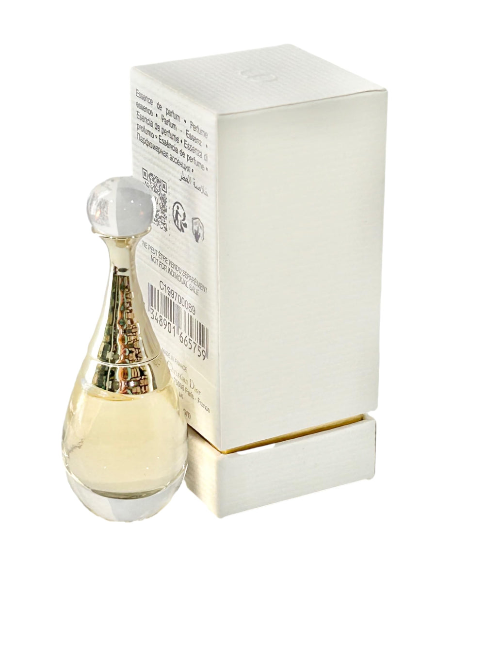 Dior J'adore Essence L'Or mini bottle in hand for discreet fragrance