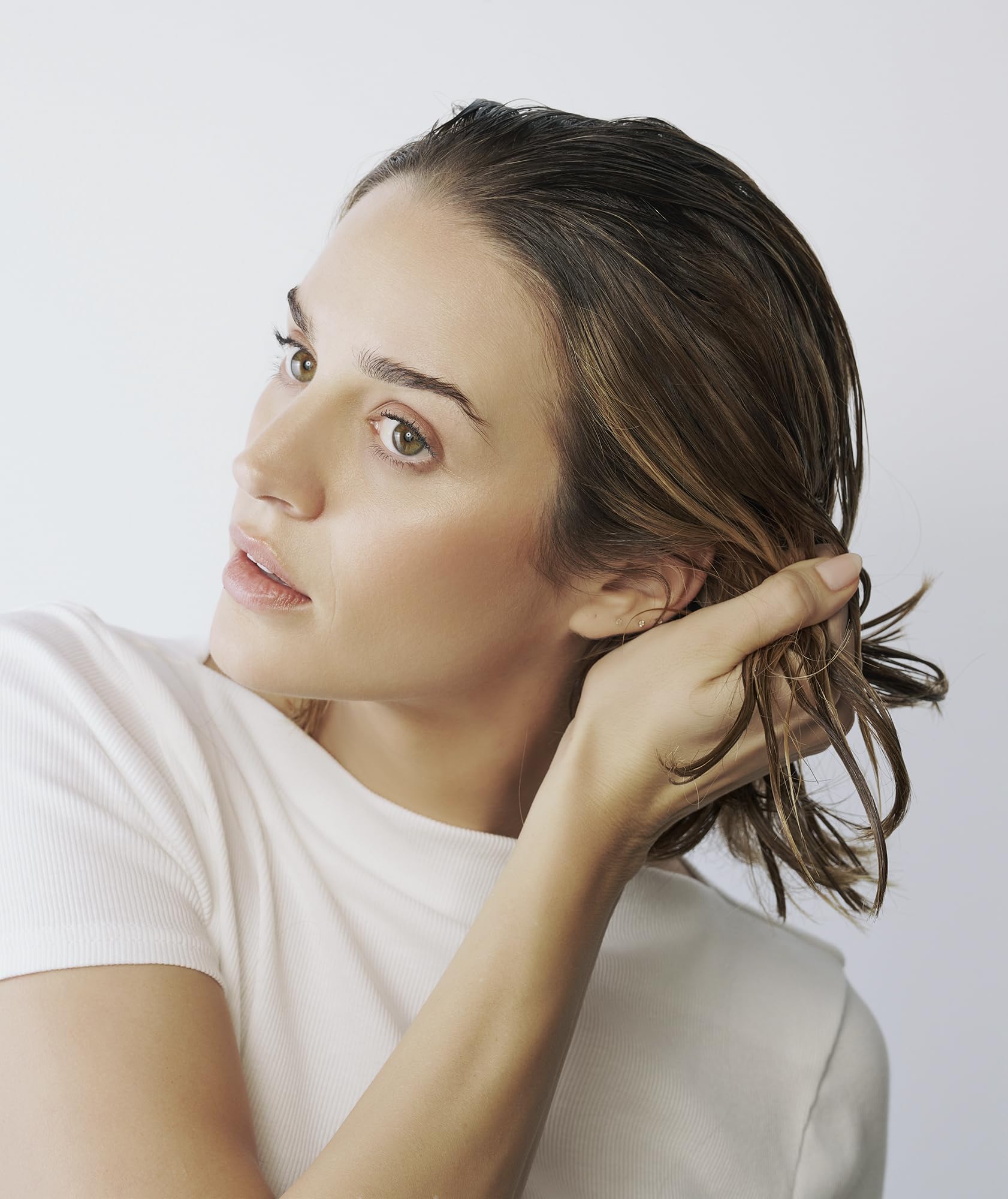 In-hand Divi Air Dry Cream shows lightweight, silky texture.