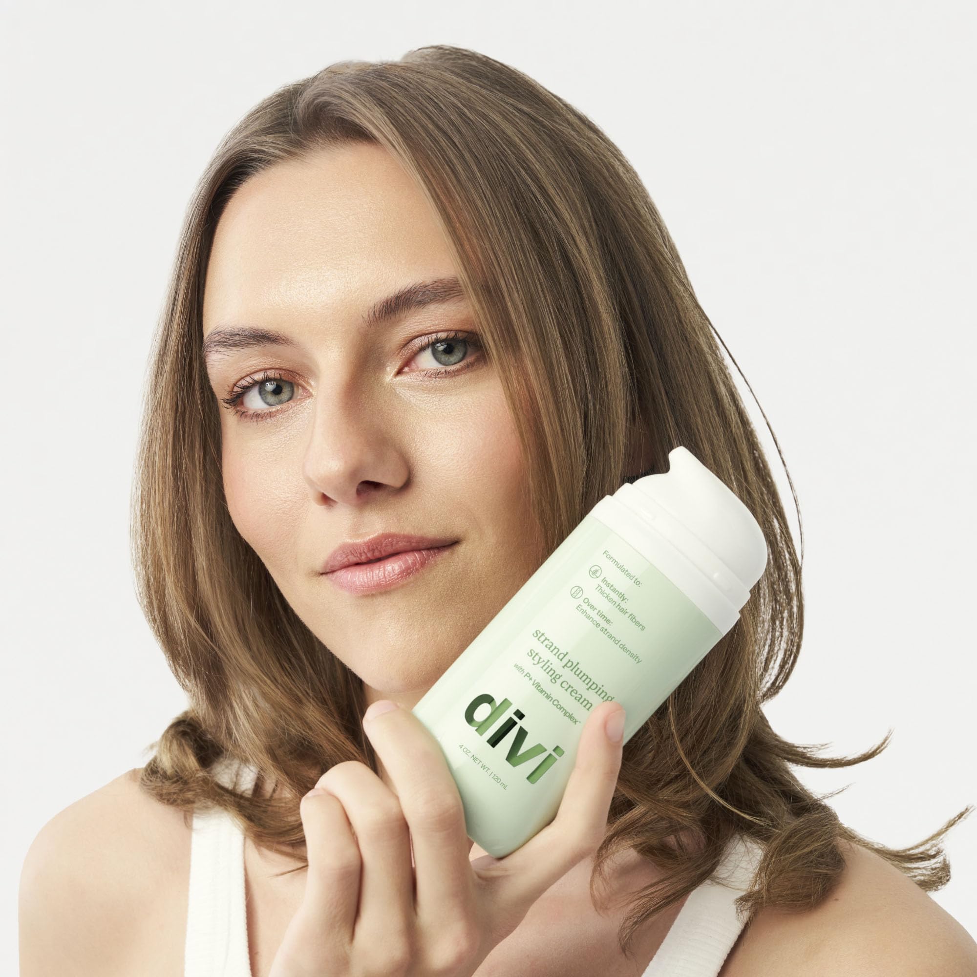 Styled hair shows smooth, polished finish from Divi Strand Styling Cream.
