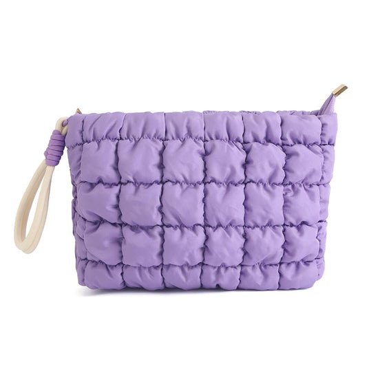 DOB SECHS puffer makeup bag in purple with soft quilted texture cushions cosmetics.