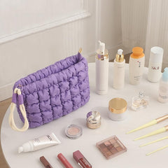 DOB SECHS puffer makeup bag with smooth zipper keeps items secure.