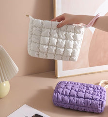 DOB SECHS small blue toiletry bag is lightweight and portable.