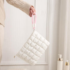 DOB SECHS travel pouch keeps cosmetics organized during trips.