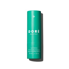 Doré La Crème bottle pour shows hydration ready for daily skincare routine.