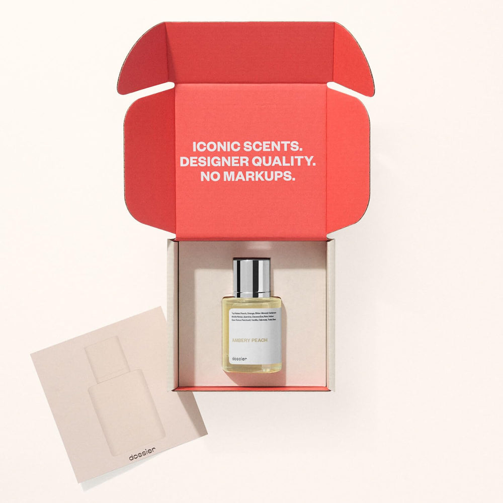 Dossier Ambery Peach gift box opening, elegant unboxing experience.