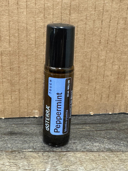 doTERRA Peppermint Touch roll-on application demonstrates quick, soothing aroma for focus and travel.
