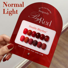 Double Rhythm maroon shimmer polish bottle highlighting rich color.