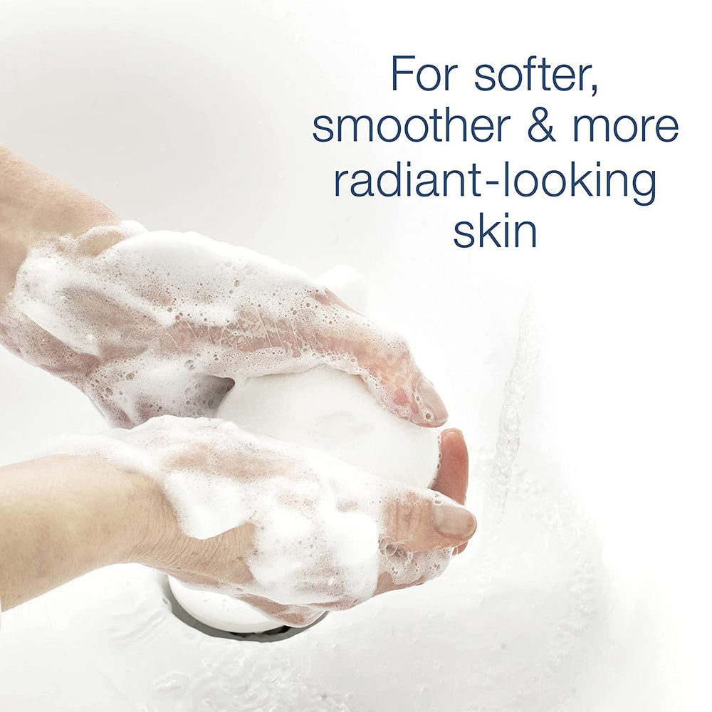 Dove Beauty Bar White 4oz bar on a towel ready for routine cleansing.