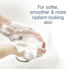 Dove Beauty Bar White 4oz bar on a towel ready for routine cleansing.