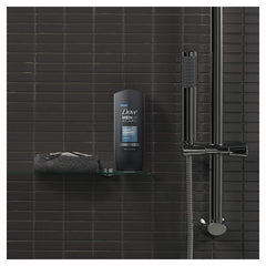 Hands holding Dove Men Clean Comfort bottle, easy everyday cleansing