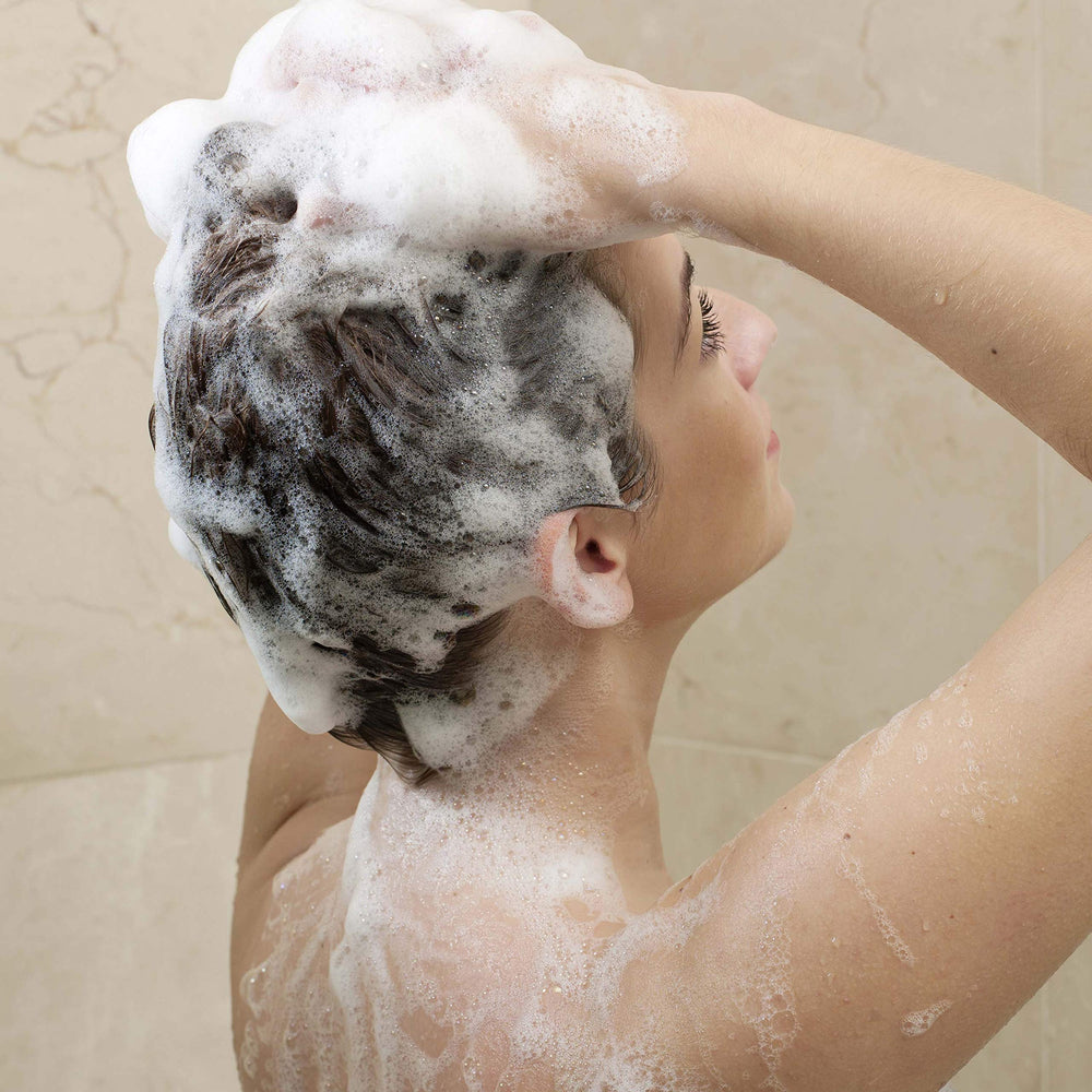 Dove Daily Moisture Shampoo used as part of a daily hair care routine.
