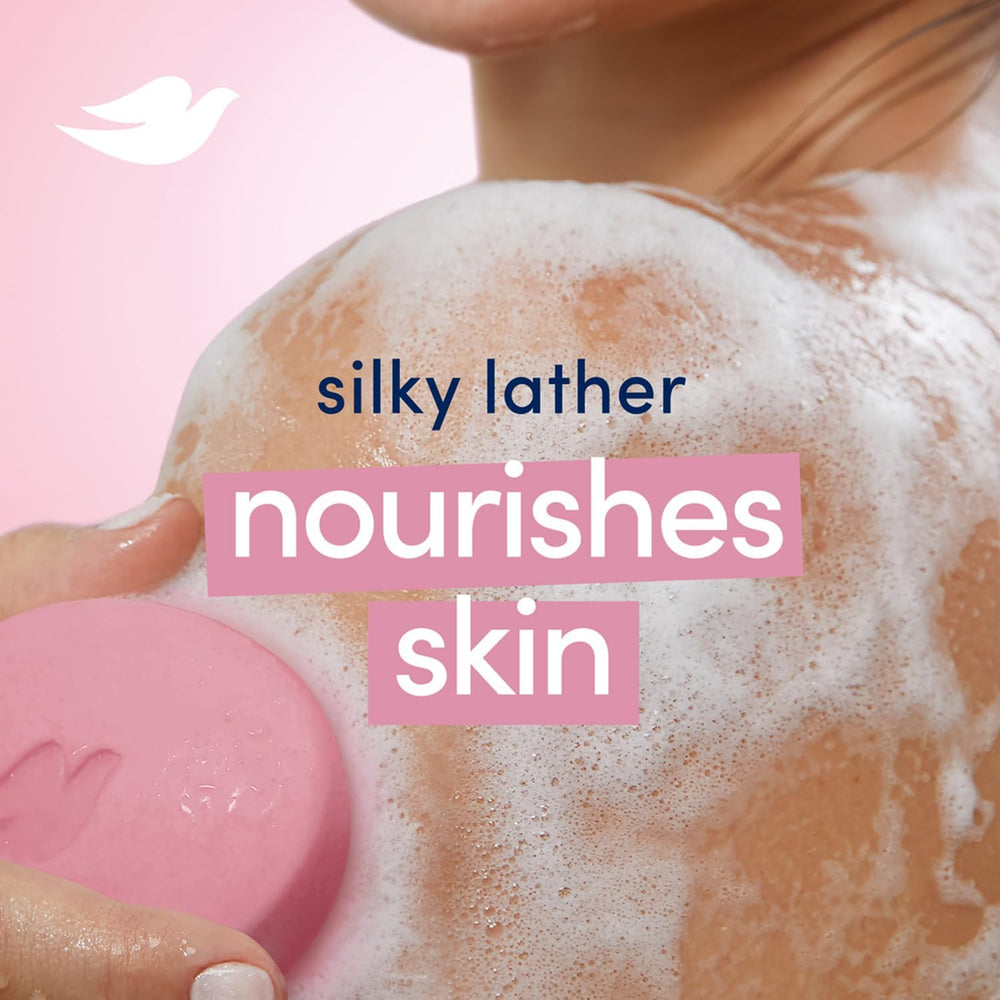 Hands lathering Dove Pink Beauty Bar for smooth skin after rinsing.