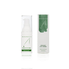 Fingertip with DR. ALKAITIS eye crème texture, hydrating delicate skin.