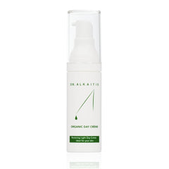DR. ALKAITIS Organics Day Crème bottle with creamy texture and daily protection.