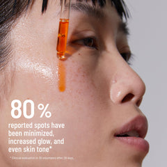 Dr. Brandt Bright This Way Glow Overnight Oil application on hand.