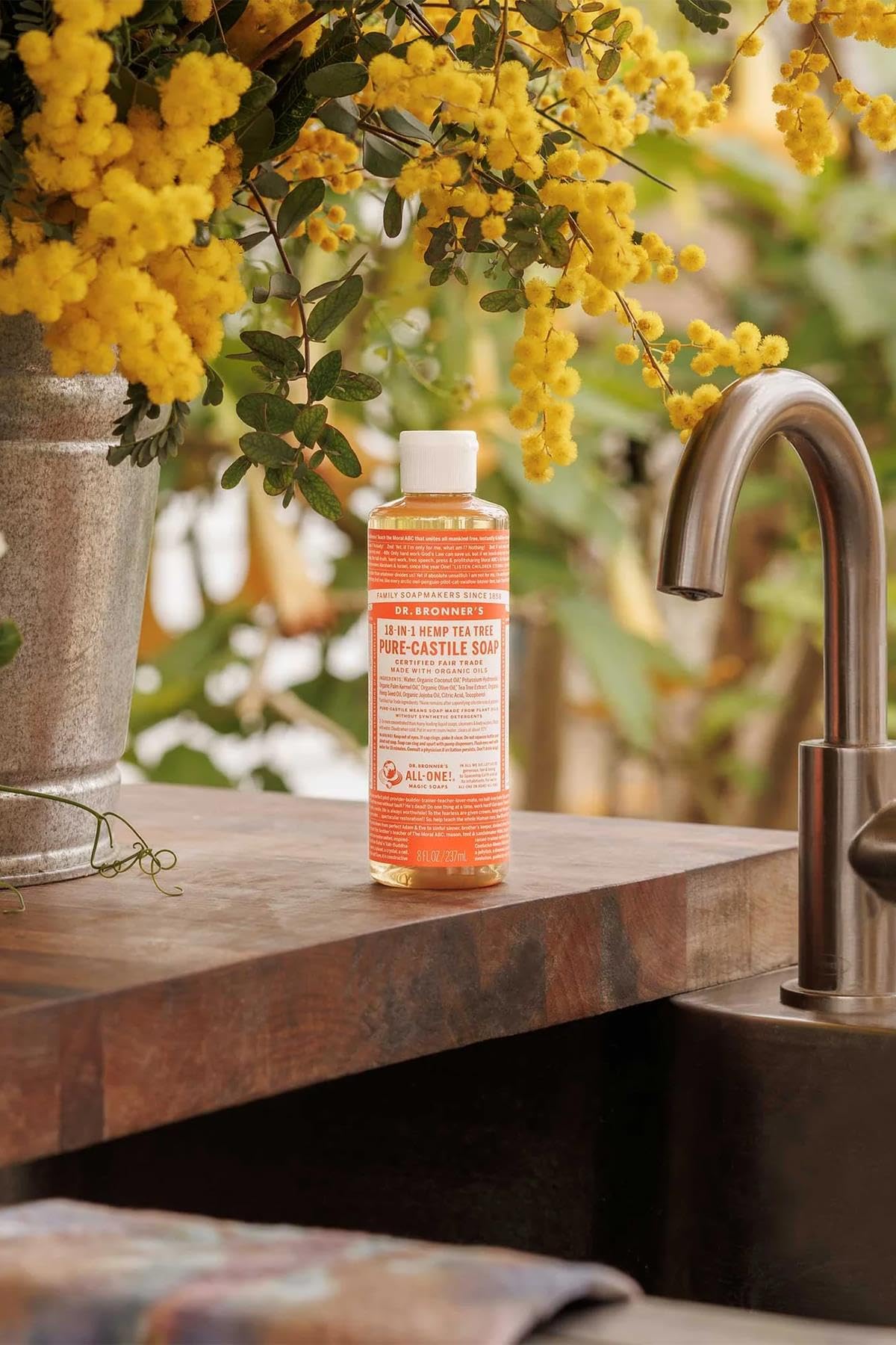 Close-up of Dr. Bronner's Tea Tree Castile soap label, ideal for multi-use washing.