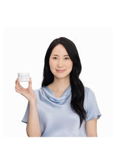 Applying Dr. Grace Ultimate Peptide Cream to the hand.
