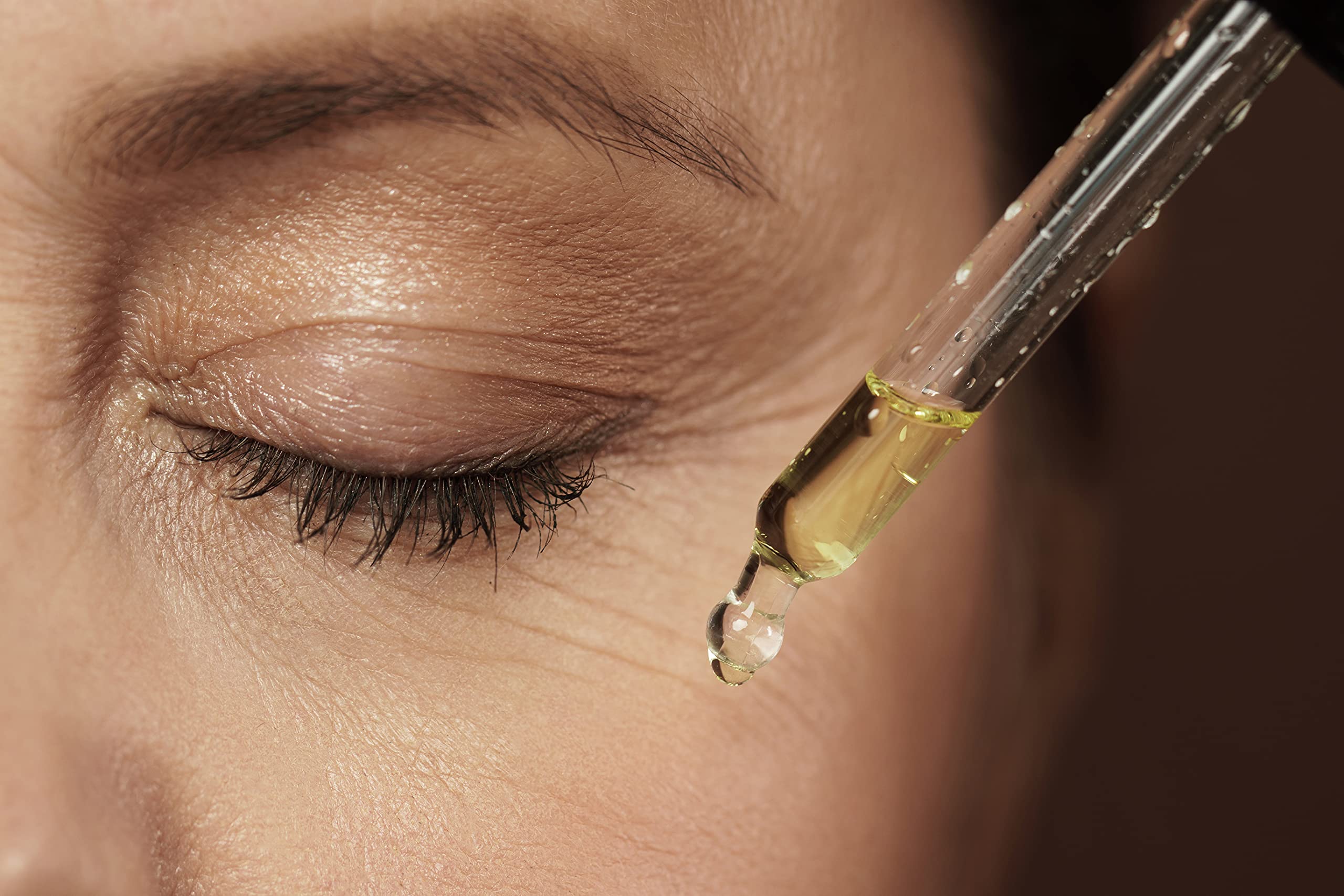 Close-up of Vitamin E oil texture ready for quick absorption.