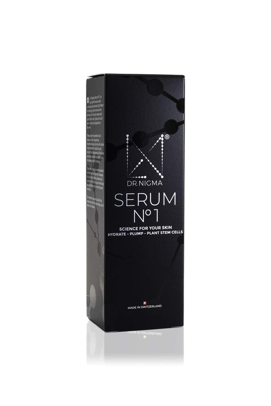 DR. Nigma Serum No 1 in hand, illustrating application for plump hydration