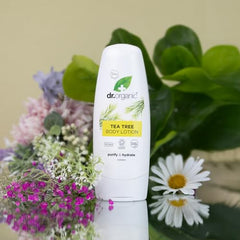 Hand application of Dr. Organic Tea Tree Skin Lotion for moisturized, refreshed skin.
