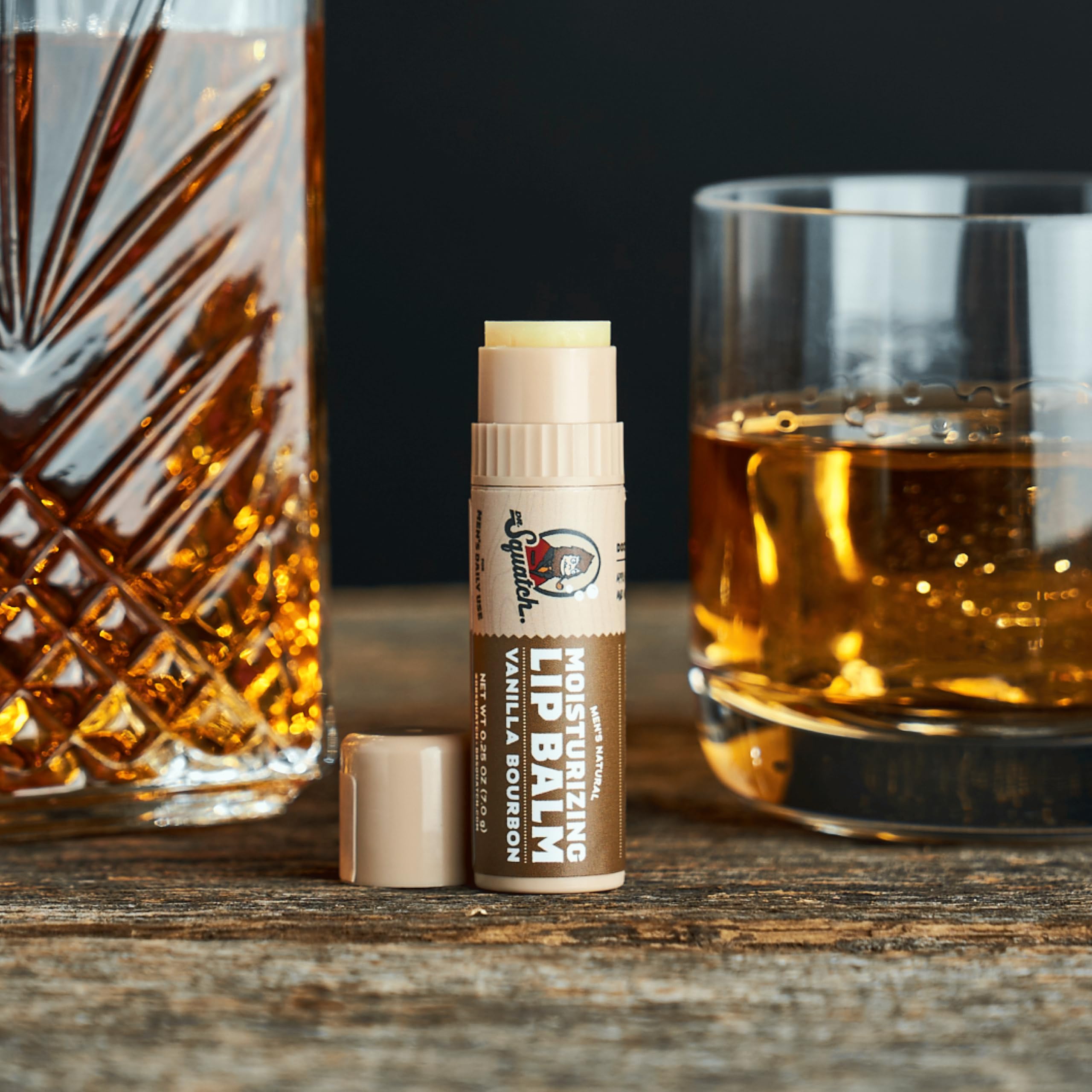 Dr. Squatch Vanilla Bourbon lip balm moisturizes lips with subtle vanilla notes.