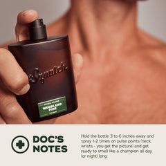 Dr. Squatch Woodland Pine Cologne bottle on wood backdrop for everyday adventure.