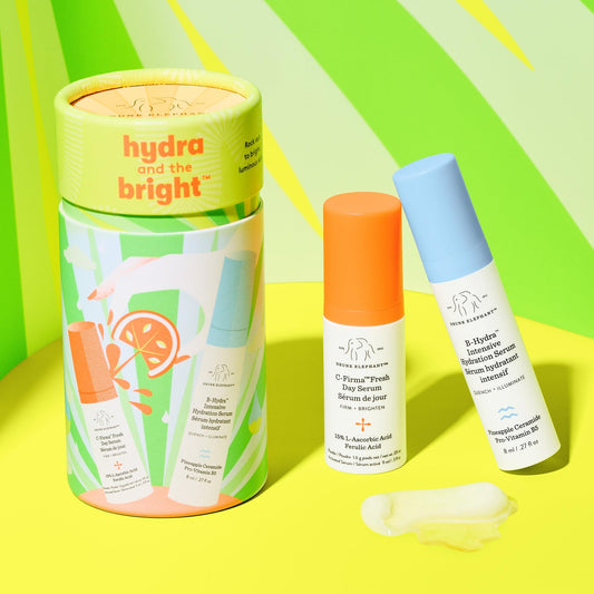 Drunk Elephant C-Firma serum bottle close-up highlighting vitamin C application.