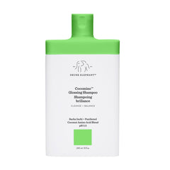 Drunk Elephant Cocomino shampoo bottle shows gentle cleanse for color-treated hair.