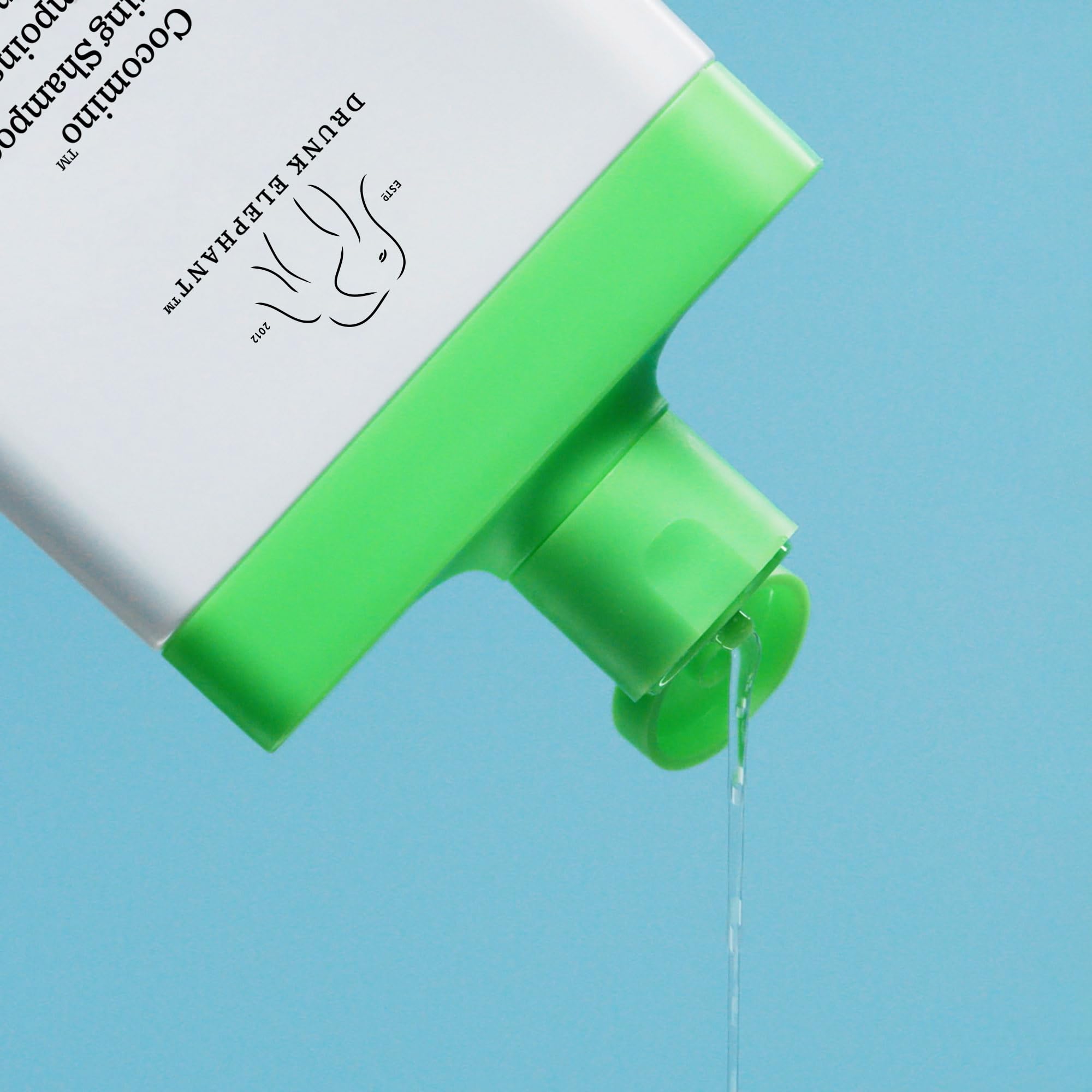 Cocomino glossing shampoo lather highlighting rich foam and easy rinse for smooth hair.