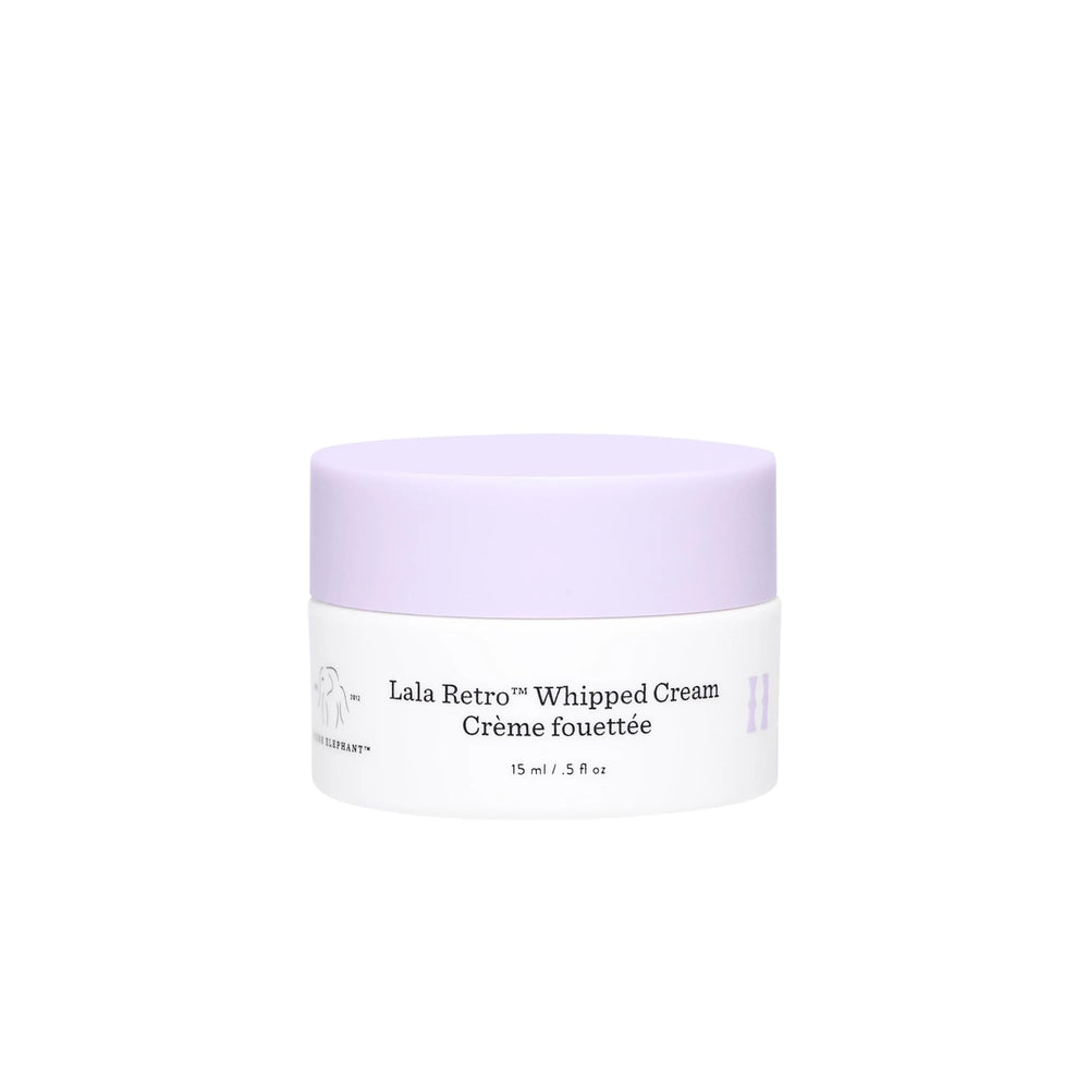 Drunk Elephant Lala Retro whipped cream jar close-up showing airy texture for daily moisture.