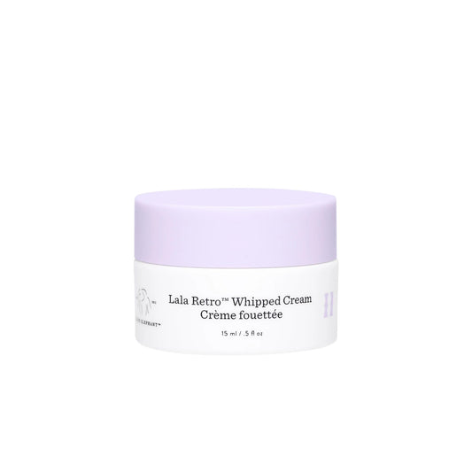 Drunk Elephant Lala Retro whipped cream jar close-up showing airy texture for daily moisture.